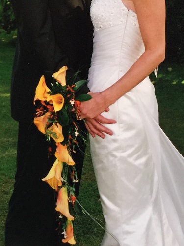 Wedding Couple standing with floral corsage